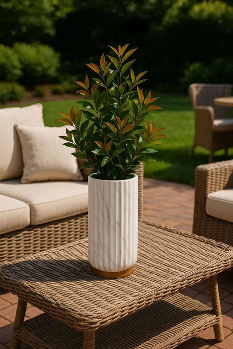 A set of marble-finish ceramic vases in a Scandinavian-inspired modern design, styled with greenery and decorative books, ideal for minimalist home decor in U.S. interiors.